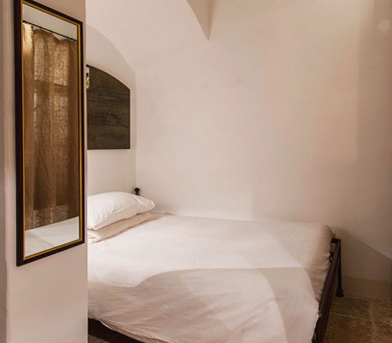 Eremito Celluzza with bed and essential stone interior